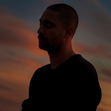 Silhouette portrait of Amos Le Blanc against a warm sunset
